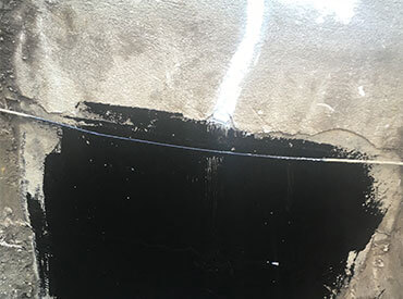 Installation of a tar membrane to promote waterproofing